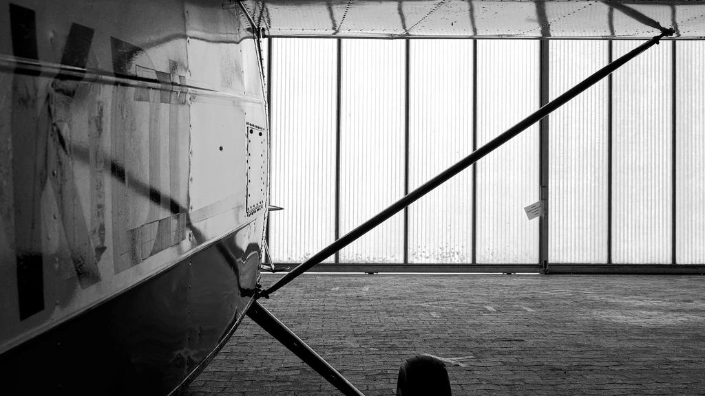 A still hangar interior at the close of a hearing day